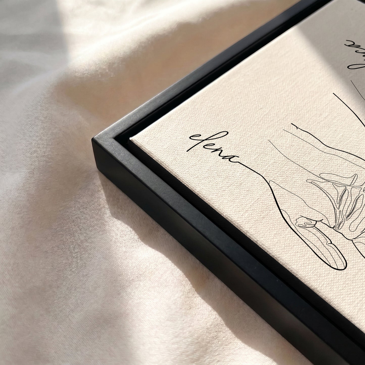Close-up of the Black floating framed canvas.