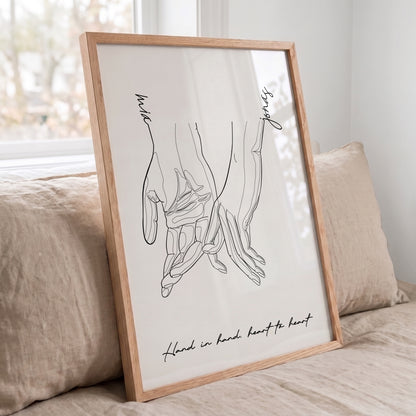 Custom couple line art print displayed in a Red Oak frame with personalized names and quote.