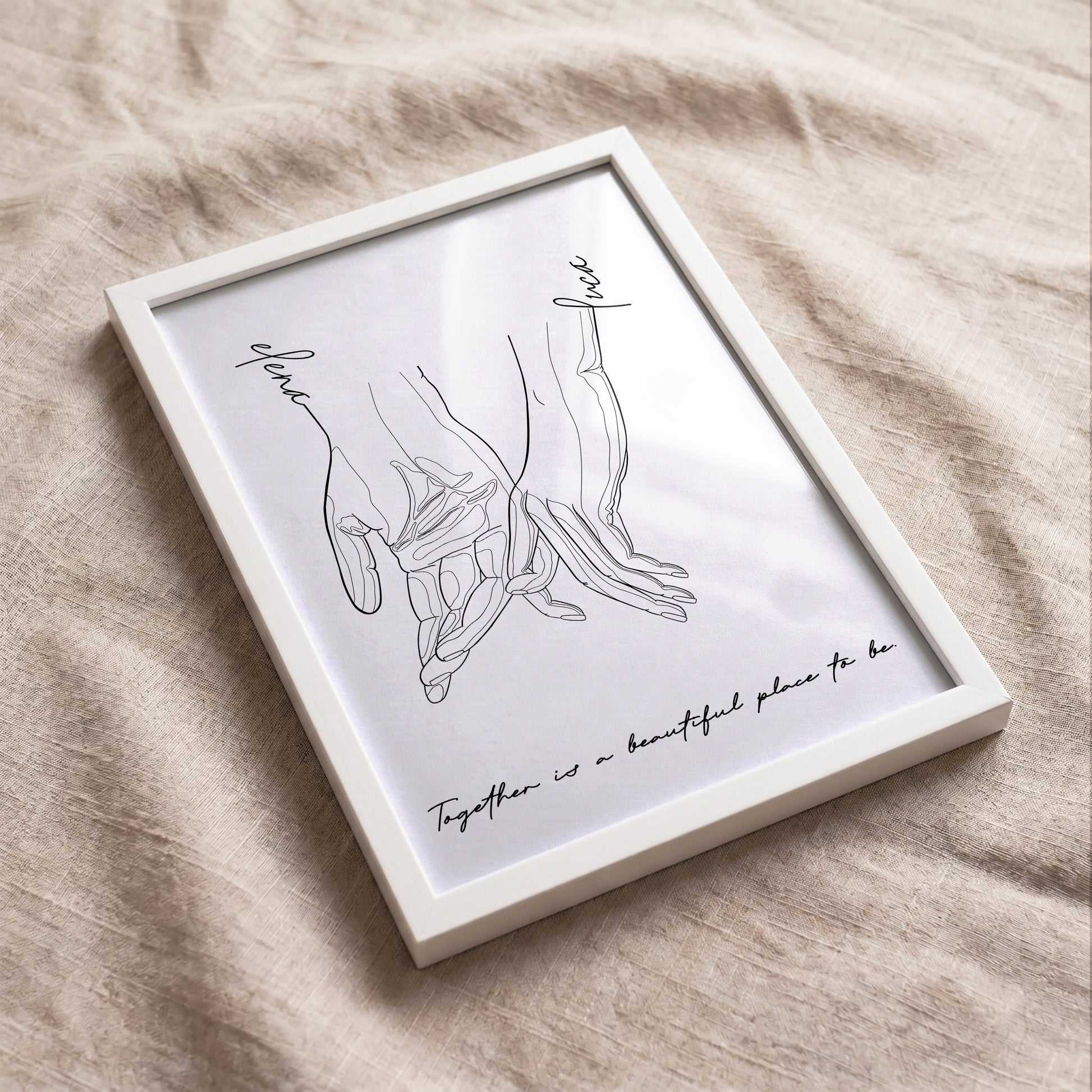Minimalist personalized couple print displayed on neutral fabric with custom names and quote.