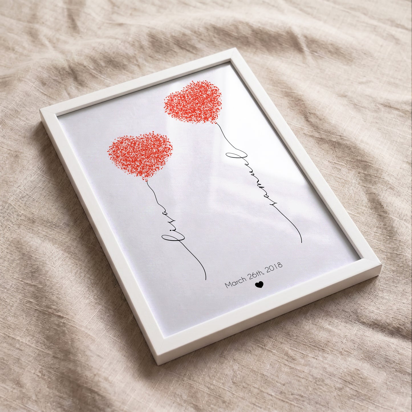 Custom fingerprint heart artwork with personalized names, optional quote, and anniversary date displayed in a white frame.