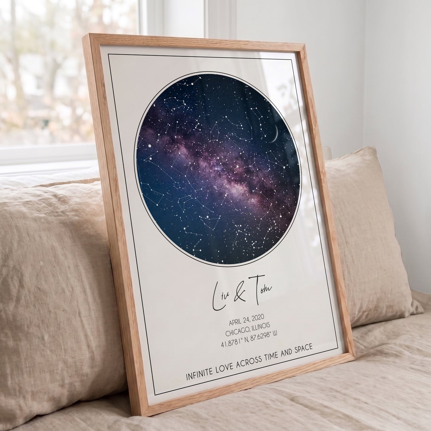 Angled view of a custom circular constellation print in a natural oak frame.