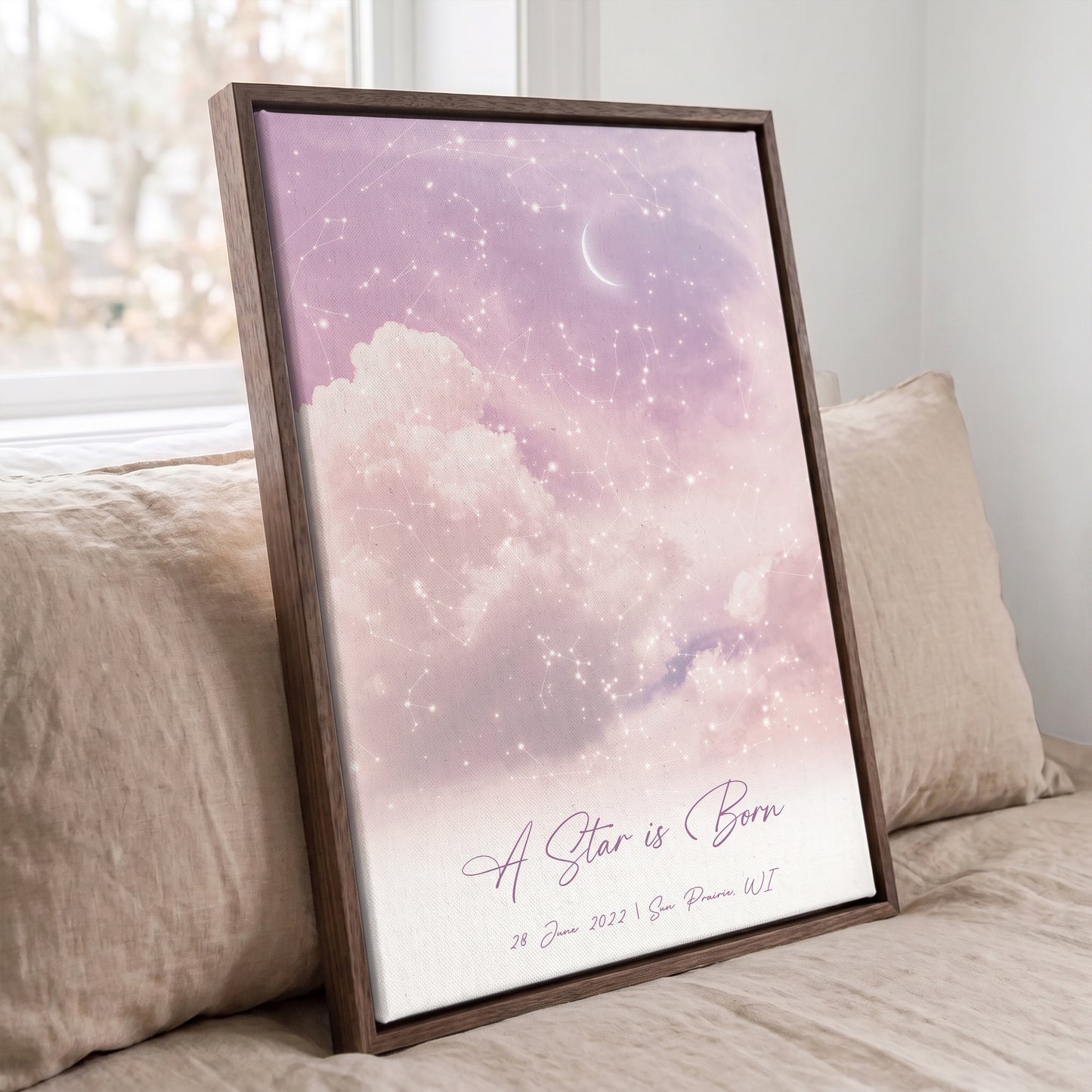 Personalized star map wall art displayed in a brown frame with dreamy cloudy sky background.