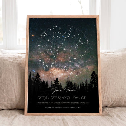 Personalized Star Map print in natural oak frame displayed on a neutral linen sofa with soft daylight.