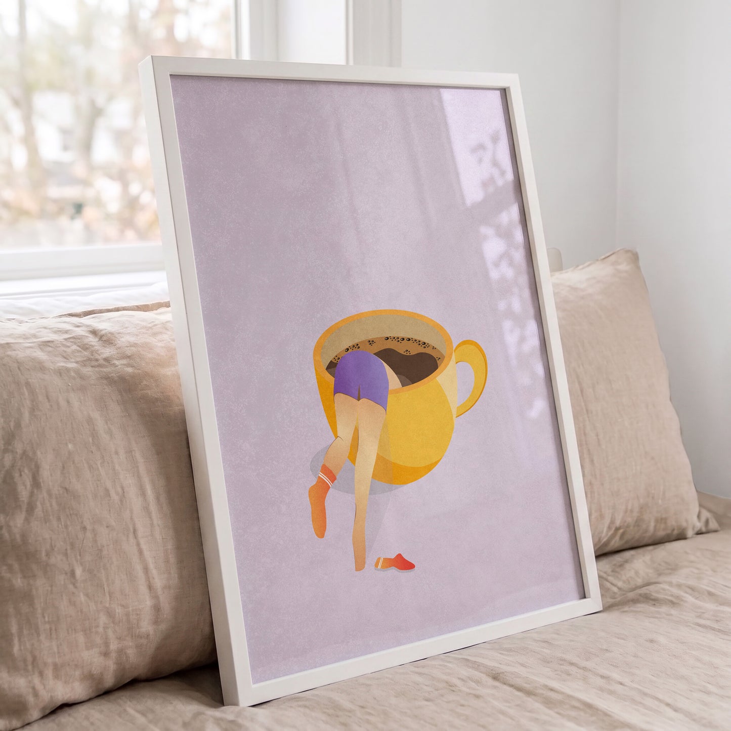 Surreal illustration of a woman in a coffee cup framed in a white wood frame